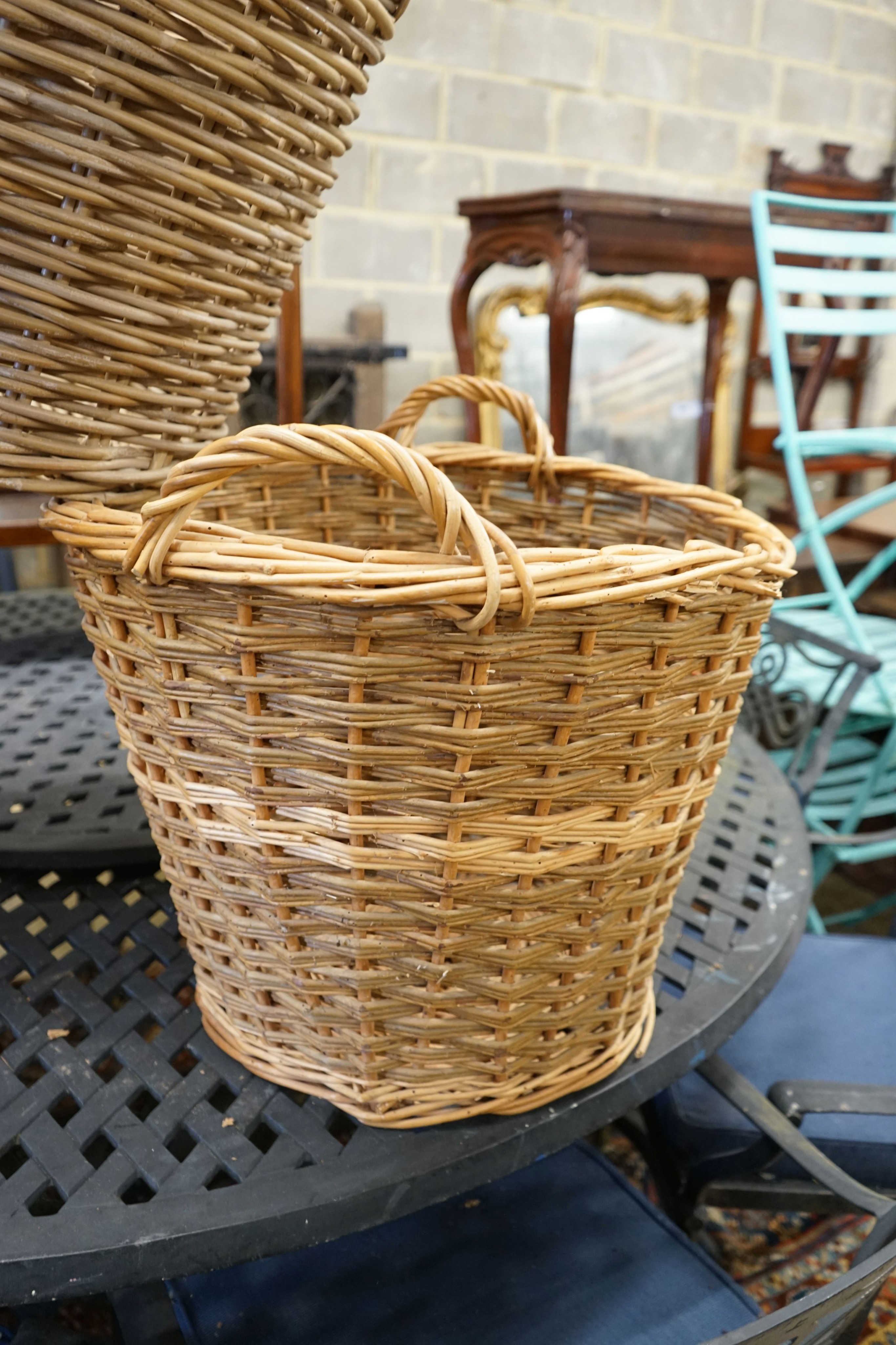 Three aassorted wicker baskets, largest width 59cm, height 53cm